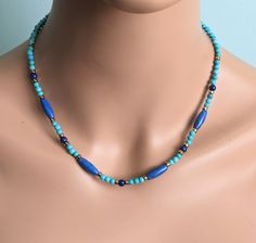 The necklace is made of 15 mm. barrel and 5 mm. lapis lazuli beads, 4 mm. turquoise beads and adorn gold tone Japanese spacer beads.   A length is 16  - 18'' ( 40 - 47.5 cm. ).  The necklace will be packaged in a gift box.   Your jewelry is ready to ship.   Thank you for visiting my shop. Blue Turquoise Necklace With Polished Beads As Gift, Adjustable Blue Turquoise Necklace With Spacer Beads, Blue Turquoise Gemstone Beads Necklace For Spiritual Style, Spiritual Blue Turquoise Necklace With Gemstone Beads, Blue Turquoise Necklace With Spacer Beads As Gift, Spiritual Blue Turquoise Necklace With Faceted Beads, Turquoise Lapis Lazuli Beaded Necklace With Polished Beads, Blue Oval Beaded Necklaces With Natural Stones, Spiritual Blue Turquoise Necklace With Spacer Beads