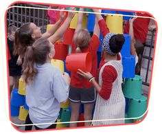 children playing with giant blocks at an amusement park