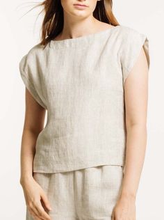 Our iconic Everyday Top is handcrafted from luxurious certified organic linen in new, Natural linen. This easy, minimalist top features a wide neckline, slightly boxy body, and mid-to-cropped length, perfect for tucking into our Everyday Crop Pant or wearing with your favorite jeans. We appreciate the natural beauty of linen's undyed color and are excited to highlight it this season in our new Natural colorway. Made with Organic Linen Lined with Organic Cotton Handmade in India Machine wash cold Minimalist Top, Organic Linens, Natural Linen, Favorite Jeans, Cropped Pants, Natural Beauty, Organic Cotton, India, How To Wear