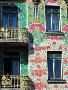 a multicolored building with balcony and balconies