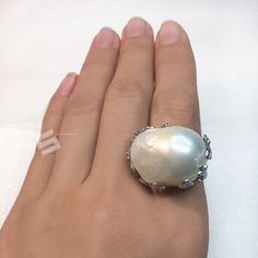 Very unique Baroque pearls adjustable band ring, pearls sized 16x23mm with strong luster which is a statement! With well-made sterling silver band, protect and goes well with the shape of pearls, makes the shape of pearl more special, every pearl has been picked by myself, to make sure the shape is intersting and the luster is good enough. Quality: AAA Color: Natural White Luster: highest sheen and luster Nacre: lustrous and thick nacre Blemish: 97% - 99% Clear Shape: Baroque Size:16x23mm approx Elegant Oval Mother Of Pearl Ring, Wedding Pearl Ring In Mother Of Pearl, Wedding Pearl Ring With Mother Of Pearl, Formal Mother Of Pearl Round Ring, Formal Round Mother Of Pearl Ring, Formal Mother Of Pearl Ring, Silver Pearl Ring With Mother Of Pearl As Gift, Silver Mother Of Pearl Ring As Gift, Silver Mother Of Pearl Ring For Gift