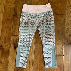 Excellent Condition! Possibly Nwot. No Signs Of Any Wear Or Flaws Colors: Light Pink, Gray And Hints Of White Has A Dotted Print Throughout The Leggings Except The Waist Waist Is Elastic Had A Mesh Material That At The End Of Leggings That Start From The Side To The Back Length: 29in Inseam: 19 1/2in Spring Sports Capris, Fitted Pink Capris For Summer, Pink Stretch Capris For Spring, Fitted Pink Capri-length Bottoms, Pink Fitted Casual Capris, Spring Workout Athleisure Capris, Pink Stretch Capris For Workout, Pink Stretch Capri Bottoms, Stretch Pink Capris