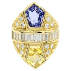 Ring Size: 6.75 An exquisitely designed cocktail ring of unparalleled beauty! This remarkable piece showcases the brilliance of natural sapphires and diamonds set in 18-karat yellow gold. The centerpiece features two large pentagon-cut natural sapphires weighing an impressive 5.33 carats with a captivating color combination of yellow and blue. A row of fifteen baguette-cut diamonds (F-G / VS1-VS2) totaling 0.73 carats is nestled between the sapphires. The diamonds are flawlessly channel-set, radiating a dazzling brilliance. The allure continues with 12 round brilliant cut diamonds, elegantly pave-set throughout the ring, totaling 0.58 carats. The sparkling diamonds add an extra touch of shimmer, enhancing the ring's overall magnificence. Crafted in 18-karat yellow gold, the setting complem Yellow Gold Cocktail Ring, Jewelry Appraisal, Gold Cocktail Ring, Contemporary Ring, Gold Cocktail, Sapphire Color, Baguette Cut Diamond, Channel Set, Baguette Cut