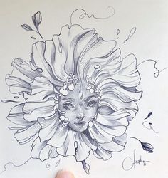 a drawing of a woman's face with flowers in her hair