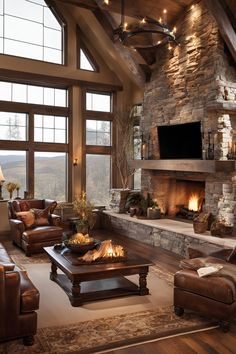 a living room filled with furniture and a fire place in front of a large window