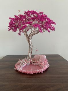 a small tree with pink flowers on it