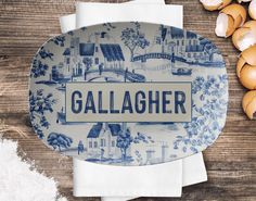 a blue and white plate sitting on top of a wooden table next to some eggs