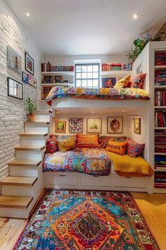 a room with some bookshelves, stairs and a bed in the middle of it