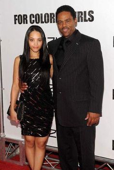 the man and woman are posing together on the red carpet at an event for color girls