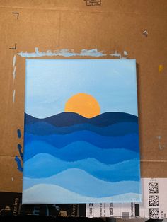 an acrylic painting of the sun setting over mountains and ocean waves on canvas