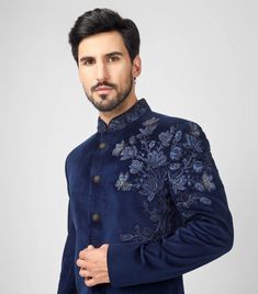 Blue Indo Western Sherwani With Floral Hand Embroidery  *Premium Quality Velvet  Fabric *Colour Blue ( Can be done in any color) * Work - Embroidery, Thread Work, Dubka Work in Antique Gold, Sequin And Beads  *Buttons - Metal Buttons In Dark Gold Note For Perfect Fitting * Pls Check Your Body Chest Exact Measurement With Out Adding Any Space or Gap From Your Side * Kindly Mention Your Height While Placing The Order 🔺Disclaimer: Product Colour May Slightly Vary Due to Photographic Lighting Sources or Your Monitor Settings Thank You for Visiting Semi-stitched Indigo Wedding Sets, Semi-stitched Floral Sherwani For Diwali, Semi-stitched Floral Embroidery Sherwani For Diwali, Reception Sherwani With Floral Embroidery, Diwali Semi-stitched Sherwani With Floral Embroidery, Festive Bandhgala With Floral Embroidery For Wedding, Festive Floral Embroidered Bandhgala For Wedding, Formal Sherwani With Floral Embroidery For Diwali, Bollywood Style Semi-stitched Sherwani With Floral Embroidery