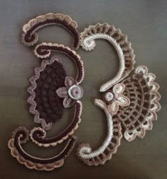 two crocheted doily designs on a brown surface