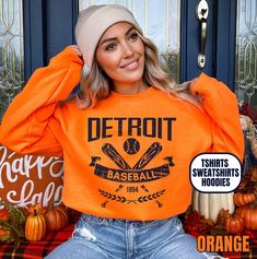 Please read the description completely and review all photos before ordering. Our Detroit Baseball Apparel is the perfect way to cheer on the home team this season. Ideal for game day, tailgates or everyday wear. Makes a great gift for any fan. This listing is for the distressed design. Click the link below for the non-distressed version: https://tandtapparel21.etsy.com/listing/1672213846/vintage-style-detroit-baseball-t-shirt SHIRT DETAILS Bella Canvas Unisex - Solid colors: 100% Cotton. - Heather colors: 52% Cotton + 48% Polyester - Runs true to size. (For looser or oversized fit consider going up a size or 2. See photos for size chart.) SWEATSHIRT & HOODIE DETAILS Gildan Heavy Blend Unisex - 50% Cotton + 50 Polyester - Runs true to size. (For looser or oversized fit consider going up a Collegiate Winter T-shirt For Streetwear, Pre-shrunk School Spirit Hoodie For Sports Season, Orange Sporty Crew Neck Hoodie, Orange Crew Neck Sporty Hoodie, Sporty Orange Sweatshirt With Letter Print, Crew T-shirt For Sports Events, Varsity Crew Neck Sports Hoodie, Fan Apparel Tops With Mascot For Sports Events, Team-colored Sports Sweatshirt