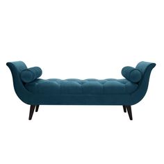 an upholstered bench with buttons on the back and arms, in blue velvet