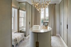 a bedroom with a chandelier hanging from the ceiling