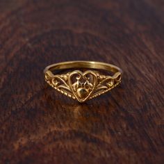 "Gold Filled Heart Ring, Dainty Love Heart Ring, Stacking Ring, VIntage Ring, Unisex Ring, Handmade ring, Boho ring, Valentine's Gift ring. ❥ The brass metal will develop a nice antique color over time. So, I suggest cleaning it once in a while for getting back to the shiny original color. You can use natural ingredients like lemon or vinegar with water to clean it. Also, apply a thin coat of transparent nail paint/nail enamel on the ring's inner side to save it from being tarnished. All our products are Nickel and Lead-free & tarnish-resistant. ❥ Etsy is an artist-based community and it is a poor ETSY manners to leave a negative review before communicating with your seller. Please contact me prior to leaving any unsatisfied feedback. ❥ Since international mail is affected by several circu Love Heart Ring, Gold Claddagh Ring, Paint Nail, Gold Heart Ring, Claddagh Ring, Claddagh Rings, Jewelry Accessories Ideas, Dope Jewelry, Ring Stacking