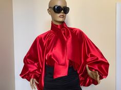 "This is a very stylish Womens Satin blouse in beautiful Candy apple red color. It is comfortable and cozy. Made for a free flowing fit. Great for all year around and for any special occasion or casual day can be dressed up or dressed down. SIZE CHART SIZE S - US 6, UK 8, EU 36 bust: bust around 34.5\"/90cm Waist: waist around 27.5\"/70cm Hips: hips around 34.5\"/90cm SIZE M - US 8, UK 10, EU 38 bust: bust around 37.5\"/95cm Waist: waist around 29.5\"/75cm Hips: hips around 37.5\"/95cm SIZE L - Puffy Blouse, Satin Bow Blouse, High Neck Shirt, Blouse High Neck, Black Satin Blouse, Victorian Collar, Red And Black Outfits, High Neck Shirts, Satin Bluse