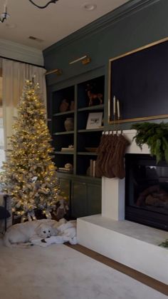 a living room with a christmas tree and fireplace