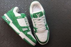 Step up your sneaker game with these statement-making kicks, channeling the iconic Louis Vuitton LV Trainer silhouette. The vibrant green and crisp white colorway creates a bold contrast, while the subtle monogram detailing adds a touch of luxury. Crafted with meticulous attention to detail, these sneakers offer a premium look and feel, perfect for those seeking a unique blend of streetwear style and high-fashion inspiration. Green Sneakers With Logo And Round Toe, Green Round Toe Sneakers With Logo, Casual Green Sneakers With Embossed Logo, Green Logo Sneakers For Streetwear, Trendy Green Leather Sneakers, Green Leather Sneakers With Embossed Logo, Luxury Green Sneakers With Branded Insole, Luxury Green Sneakers For Streetwear, Trendy Green Custom Sneakers For Streetwear