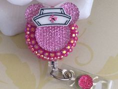 "This listing is for (1) Pink / Hot Pink Rhinestones Resin Minnie Mouse Retractable ID Badge Reel with a choice of Swivel Clip (Swivel 360 degrees) or Belt Clip. The Badge Reel with Clear Vinyl Strap is available in Black ,White and Clear. The choice of the design/pattern: With A Nurse Hat, With A Bow Or With A Rose. Please select your choice from the drop down menu. The Reel diameter is 1 1/4\"(32mm) and the cord stretches out to approx. 34\". If you have any questions or like to have a custom Puppy Boy, Pink Mouse, Nurse Hat, Id Badge Reels, Nurse Badge Reel, Nurse Badge, Bubble Envelopes, Clear Vinyl, Belt Clip