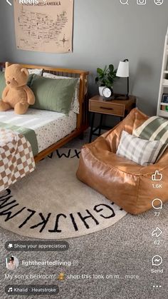 a bed room with a chair and a teddy bear on the floor next to a book shelf