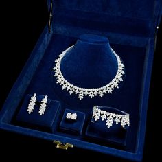 Luxury Swarovski Zirconia Jewelry Set. Bridal Necklace, Earrings, Bracelet & Ring Set, Elegant Wedding Accessories, Crystal Jewelry Gift Set This elegant and luxurious set, adorned with Swarovski zirconia stones, offers a captivating elegance that makes every woman feel special. The set includes a stunning necklace, a delicate bracelet, sparkling earrings, and a dazzling ring, making it the perfect choice for special occasions, parties, and weddings. The necklace, designed with modern sophistica Swarovski Jewelry Necklace, Accessories Crystal, Ring Making, Bracelet Ring, Sparkle Earrings, Swarovski Jewelry, Stunning Necklace, Wedding Jewelry Sets, Feel Special