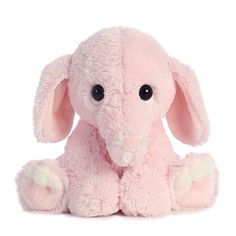 a pink stuffed elephant sitting up against a white background