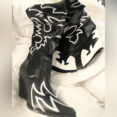 Nwot Dolls Kill Size 7 Black & White These Will Draw 'Em In So You Can Break Their Heart. These Slouchy Knee High Cowboy Boots Have White Embroidered Details, A Chunky Heel, And A Pointed Toe. Man Made Materials Leather 3.25" Heel 21.25" Shaft Tags: Concert, Country, Festival, Rock, Southern, Cowboy, Nashville, Texas, Halloween, Costume, Trendy Black Festival Boots, Black Spring Festival Boots, Trendy Fitted Black Wedge Boots, Edgy White Party Boots, Retro Black Boots For Party, Retro Black Boots For Spring, Black Wedge Boots For Spring Parties, Retro Black Heeled Boots With Round Toe, White Western Party Boots