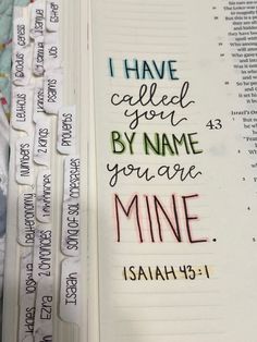 an open bible with the words i have called by name you are mine