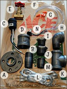 an assortment of different types of fittings and parts on a piece of plastic wrap