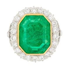 This absolutely breath-taking Art Deco Emerald ring is definitely one to be admired. With a simply stunning centre Emerald, origin Colombian and a lovely sea green colour to it, it has been certified by The Gem & Pearl Lab as moderately enhanced. It has a weight of 16.10 carat and is held in perfect position with an 18 carat yellow gold rub over setting. Working hand in hand with the Emerald to highlight it's beauty, it a beautiful halo of transitional cut diamonds. The diamonds have an estimate Trillion Diamonds, Art Deco Emerald Ring, Emerald Wedding Rings, Green Emerald Ring, Emerald Ring Gold, Platinum Diamond Rings, Emerald Diamond Ring, Diamond Halo Ring, Colombian Emeralds