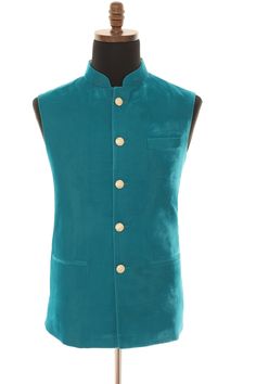 Introducing the Turquoise Luxurious Velvet Nehru Men's Jacket, the perfect blend of sophistication and style for your next party or special occasion. This premium-quality jacket is crafted from rich, soft velvet fabric that offers a luxurious feel and drapes elegantly on your body. This Nehru jacket features a classic Nehru collar, and a buttoned front, adding a touch of traditional Indian style to your outfit. The beautiful Turquoise color of the jacket exudes elegance and sophistication, making it an ideal choice for formal occasions such as weddings, formal events, and other special occasions. The Turquoise Luxurious Velvet Nehru Men's Jacket is tailored to provide a comfortable, flattering fit, and is versatile enough to be paired with a variety of clothing items such as tailored pants Luxury Tailored Nehru Jacket For Men, Formal Blue Nehru Jacket With Stand Collar, Blue Formal Nehru Jacket With Stand Collar, Fitted Nehru Jacket For Party In Winter, Fitted Green Nehru Jacket For Semi-formal Occasions, Green Fitted Nehru Jacket For Semi-formal Occasions, Blue Nehru Jacket For Semi-formal Winter Events, Formal Green Fitted Nehru Jacket, Fitted Green Nehru Jacket For Party