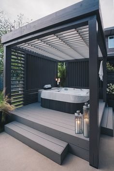 a hot tub sitting on top of a wooden deck