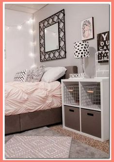 a bedroom with white walls and pink bedding