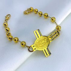 Our large cross bracelet features a prominent cross bead as its centerpiece, elegantly linked with smaller cross beads throughout the chain—a symbol of faith designed to inspire and empower you on your spiritual path. Available in silver and gold. Gold Cross Beaded Bracelets For Gift, Gold Cross-shaped Beaded Bracelets For Gifts, Gold Cross Beaded Bracelets For Spiritual Style, Gold Beaded Cross Bracelets For Spiritual Style, Gold Cross-shaped Spiritual Beaded Bracelets, Adjustable Gold Beaded Cross Bracelets, Gold Spiritual Beaded Cross Bracelets, Spiritual Gold Beaded Cross Bracelets, Gold Rosary Bracelet With Cross And 8mm Beads