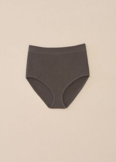 ALL SALE ITEMS ARE FINAL. Indulge in ultimate comfort with the Lauren Manoogian Rib Brief in Coal. This luxurious piece features a soft rib knit material made from stretchy Pima cotton, providing a cozy fit. Its high-waisted design and fully fashioned construction elevate the elegance of this brief, making it a must-have for any wardrobe. Available in Coal Flat micro rib Made with soft Pima cotton Made in Peru Machine wash cold, lay flat to dry Shop more women's designer intimates here. About La Gray Seamless Cotton Bottoms, Comfortable Fitted Ribbed Bottoms, Fitted Ribbed Comfortable Bottoms, Cotton Seamless Loungewear Bottoms, Solid Cotton Ribbed Bottoms, Cotton Bottoms With Seamless Construction For Loungewear, Relaxed Fit Solid Seamless Bottoms, Relaxed Fit Seamless Solid Bottoms, Solid Color Seamless Relaxed Fit Bottoms