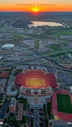 an aerial view of a football stadium at sunset