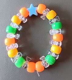 Hand-Made tight fit green, orange, yellow and blue Casual Multicolor Star-shaped Jewelry, Multicolor Star-shaped Bracelet With Colorful Beads, Casual Multicolor Star-shaped Bracelets, Casual Multicolor Star Bracelets, Bracelet Ideas, Star Bracelet, Colour Star, Yellow And Blue, Green Orange