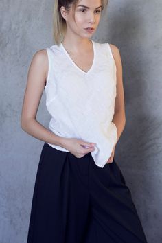 V-neck tank top made from pure, soft washed linen. «Must-have» basic linen shirt, that can be combined with any item from your closet. COMPOSITION - 100% linen, soft washed - Medium weight linen - Oeko-tex certified fabric, that does not contain any harmful substances and meets human-ecological requirements. SIZE - XS (US 2, UK 6, Europe 34, AU/NZ 6) Recommended size of BODY Bust: 31,5 in | 80 cm Waist: 24,4 in | 62 cm Hips: 33,8 in | 86 cm Size of GARMENT Bust: ± 33,8 in | 86 cm Length: ± 24,8 Solid Linen Sleeveless Tank Top, Solid Color Linen Sleeveless Tank Top, Sleeveless Linen Tank Top, White Linen Casual Vest, V-neck Linen Vest For Summer, V-neck Linen Summer Vest, Solid Linen Summer Tank Top, V-neck Relaxed Fit Tank Top For Spring, Spring V-neck Relaxed Fit Tank Top