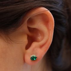 Dress up with these sophisticated pair of emerald earrings full of sparkle and chic`They look so perfectly beautiful they are an instant classic.Make a beautiful statement wherever you go!- Made to Order, perfectly finished, Fast shipping fully insured and trackable online.- Emerald information: Two 6x4mm oval cut Chatham Emeralds 1.02 ctw- Diamond information: 2X 1.5 mm, 4X 1.25 mm Diamonds, VS-E, 0.08 ctw- Arrives gift ready with a certificate of authenticity. Green Stud Earrings, Emerald Earring, Emerald Earrings Studs, May Birthstone, Gold Stud Earrings, Ruby Earrings, Emerald Earrings, Gold Stud, Dainty Earrings