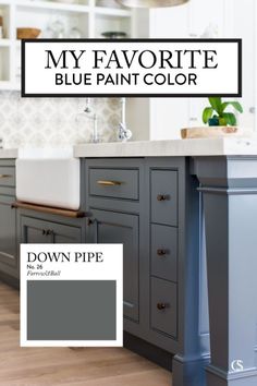 a kitchen with gray cabinets and white counter tops is featured in the color blue paint