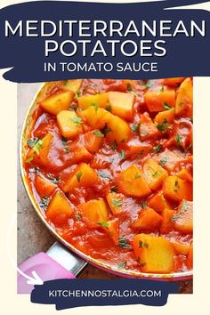 a pan filled with stew and vegetables on top of a table