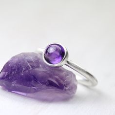 Simple Modern Deep Purple Silver Ring by NangijalaJewelry on Etsy Modern Purple Jewelry As A Gift, Modern Purple Jewelry For Gifts, Modern Purple Amethyst Jewelry, Oval Purple Natural Gemstones, Minimalist Amethyst Gemstone Jewelry, Spiritual Purple Cabochon Jewelry, Modern Adjustable Purple Jewelry, Amethyst Bezel Setting Jewelry Gift, Modern Purple Amethyst Ring For Anniversary