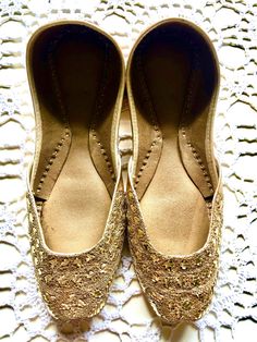 Hand crafted & Hand embroidered  Leather shoes in a beautiful bronze color embellished with rich gold thread work - often called Zardozi Zardozi comes from two Persian words: zar, meaning 'gold', and dozi, meaning 'work'. Zardozi embroidery is a type of metal embroidery. Zardozi embroidery work involves making elaborate designs using gold threads .  Khussa is a style of South Asian handcrafted footwear produced in Punjab Pakistan.Khussa are made by artisans by hand. The uppers are made of one pi Persian Words, Embroidery Zardozi, Metal Embroidery, Punjab Pakistan, Zardozi Embroidery, Embroidered Leather, South Asian, Gold Threads, Handcrafted Leather