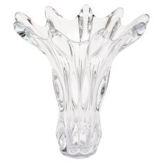 a clear glass vase sitting on top of a white table