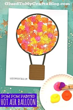 a hot air balloon craft for kids to make with paper plates and paintbrushes