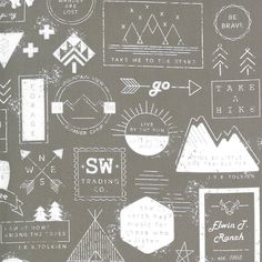 a gray and white fabric with different types of arrows, mountains, and other things on it