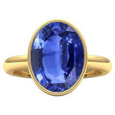 Make a bold statement with our custom-made ring featuring a 7.5-carat natural untreated Ceylon Blue Sapphire in a mesmerizing Cornflower Blue hue. Certified by the Antwerp Laboratory for Gemstone Testing, this ring is a symbol of sophistication. Materials: Gemstone: natural untreated, Ceylon Blue Sapphire AAAA highest heirloom quality Weight of Sapphire : 7.5 carats Colour Grading: Cornflower Blue Certificate: Antwerp Laboratory for Gemstone Testing Metal: 18K gold Dimension of ring head: 15 x 1 Sapphire Bezel Ring, Blue Certificate, Colour Grading, Cornflower Blue Sapphire, Ceylon Blue Sapphire, Pretty Wedding Dresses, English Art, Bezel Ring, Cornflower Blue