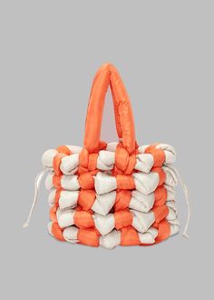 Color: Orange/White Polyamide technical fabric Knotted tote bag Internal drawstring Hanging leather logo charm Contrasting knotted detailing Fixed top handle Option to style as a hand or shoulder bag Unlined 100% Polyamide Trim: 100% Full Grain Calf Leather By JW Anderson. Made in India White Nylon Shoulder Bag With Double Handle, White Nylon Bags For Spring, White Nylon Bag For Spring, Spring White Nylon Bag, White Nylon Bags With Double Handle, White Rectangular Nylon Shoulder Bag, White Nylon Bag With Removable Pouch, White Nylon Shoulder Bag With Removable Pouch, Spring Nylon Shoulder Bag With Double Handle