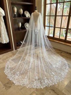 a wedding veil on display in front of a window